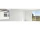 Bright and airy living room with a window and sliding glass doors that let in lots of natural light at 2530 Linda Knoll Ln, Bartow, FL 33830