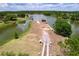 Aerial view of lakefront property and boat dock on a sunny day at 1634 Lady Bowers Trl, Lakeland, FL 33809