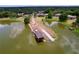 An aerial view of a lake showing community homes. A lake access point is shown at 1634 Lady Bowers Trl, Lakeland, FL 33809
