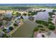Panoramic aerial showcasing waterfront homes nestled around a serene lake community at 1634 Lady Bowers Trl, Lakeland, FL 33809