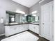 Bathroom with a double vanity, large mirrors, a fluffy rug, and modern finishes at 1634 Lady Bowers Trl, Lakeland, FL 33809