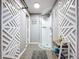 Modern bathroom featuring a glass-enclosed shower and stylish decorative privacy panels at 1634 Lady Bowers Trl, Lakeland, FL 33809
