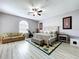 Expansive main bedroom offers a sitting area, an exercise area, and wood-look floors at 1634 Lady Bowers Trl, Lakeland, FL 33809