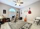 Music-themed room with guitars, studio equipment, nautical décor, and a ceiling fan at 1634 Lady Bowers Trl, Lakeland, FL 33809