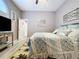 Bedroom displaying a large bed, palm tree rug, and bathroom access at 1634 Lady Bowers Trl, Lakeland, FL 33809