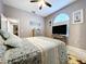 Bedroom featuring a large bed, dresser, TV, and nautical themed art and decor at 1634 Lady Bowers Trl, Lakeland, FL 33809