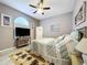 Bedroom featuring a large bed, dresser, TV, and nautical themed art and decor at 1634 Lady Bowers Trl, Lakeland, FL 33809