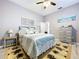 Bedroom with a large bed, dresser, and nautical themed art and decor at 1634 Lady Bowers Trl, Lakeland, FL 33809