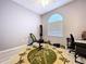 Bright bonus room with arch window, suitable for a home gym, office, or flexible living area at 1634 Lady Bowers Trl, Lakeland, FL 33809
