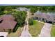 Aerial view of long driveway leading to two homes. The property is on a lake at 1634 Lady Bowers Trl, Lakeland, FL 33809