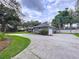 Attractive gray home features a well-kept lawn and convenient attached garage at 1634 Lady Bowers Trl, Lakeland, FL 33809