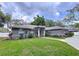 Lovely one-story home with a neatly kept lawn, arched windows, and a welcoming front entrance at 1634 Lady Bowers Trl, Lakeland, FL 33809