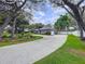 Charming home with long driveway, manicured lawn, and beautiful landscaping at 1634 Lady Bowers Trl, Lakeland, FL 33809