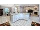 Spacious kitchen island with ample storage and granite countertops, open to living and dining areas at 1634 Lady Bowers Trl, Lakeland, FL 33809