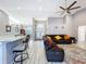 Open concept living room flowing from the kitchen with high ceilings at 1634 Lady Bowers Trl, Lakeland, FL 33809