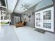 Covered patio with ceiling fans, comfortable seating, and access to the backyard and pool area at 1634 Lady Bowers Trl, Lakeland, FL 33809