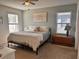 Comfortable main bedroom featuring neutral paint, cozy furnishings, and ample natural light at 2987 Neverland Dr, New Smyrna Beach, FL 32168