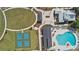 An aerial view shows the community pool, pickleball courts, and green spaces at 3013 Howley Aly, St Cloud, FL 34771