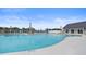 The large community pool area has ample lounge chairs and a nearby pool house at 3013 Howley Aly, St Cloud, FL 34771
