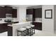 Modern kitchen with espresso cabinets, stainless steel appliances, a breakfast bar, and white subway tile backsplash at 3013 Howley Aly, St Cloud, FL 34771