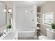 Well-lit bathroom featuring a tub-shower combo, modern fixtures, vanity, and bright finish, offering a spa-like experience at 1101 Dr Martin L King Jr Way, Haines City, FL 33844