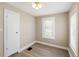 This is a cozy bedroom with natural light, neutral colors, and plank flooring at 1101 Dr Martin L King Jr Way, Haines City, FL 33844