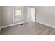 Cozy bedroom with updated floors and a window providing natural light at 1101 Dr Martin L King Jr Way, Haines City, FL 33844