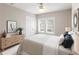 Cozy bedroom featuring a comfortable bed, stylish decor, and natural light streaming through the bright double windows at 1101 Dr Martin L King Jr Way, Haines City, FL 33844