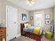 Cheerful bedroom with a twin bed, modern decor, and a bright window, creating a cozy and inviting personal space at 1101 Dr Martin L King Jr Way, Haines City, FL 33844