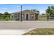 Charming home featuring a cozy front porch, meticulous landscaping, and a classic lamp post at 1101 Dr Martin L King Jr Way, Haines City, FL 33844