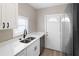 Modern kitchen featuring white cabinets, stainless steel appliances, and marble countertops at 1101 Dr Martin L King Jr Way, Haines City, FL 33844