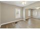 Spacious living room with contemporary flooring and bright natural lighting at 1101 Dr Martin L King Jr Way, Haines City, FL 33844