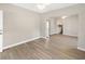 Open living room with modern flooring and a view into the kitchen at 1101 Dr Martin L King Jr Way, Haines City, FL 33844