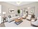 Spacious living room with modern furniture, neutral color scheme, and plenty of seating at 1101 Dr Martin L King Jr Way, Haines City, FL 33844