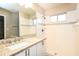 Updated bathroom with granite counters, modern hardware, and a tiled shower at 2216 Heathwood Cir, Orlando, FL 32828