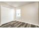 Bedroom features a large closet and neutral paint, and wood-look flooring at 2216 Heathwood Cir, Orlando, FL 32828