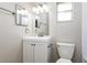 Bathroom featuring a white vanity with modern fixtures, a large mirror, and a toilet at 408 S Edgemon Ave, Winter Springs, FL 32708