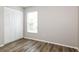 Bedroom with modern laminate floors and a large closet, providing great storage at 408 S Edgemon Ave, Winter Springs, FL 32708