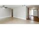 Spacious living room featuring neutral paint and tile flooring, leading to the front entrance at 408 S Edgemon Ave, Winter Springs, FL 32708