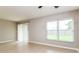 Living room showing tile floors, sliding glass door, and large window at 408 S Edgemon Ave, Winter Springs, FL 32708