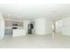 Open-concept kitchen with gray cabinets, stainless steel appliances, and an island for meal preparation and gathering at 2071 Babbling Brook Blvd, Auburndale, FL 33823