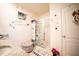 Bright bathroom featuring a granite countertop, glass-enclosed shower, and wall decor at 3017 Country Club Cir, Winter Haven, FL 33881
