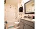 Cozy bathroom showcasing a tub with shower, granite countertop, and stylish fixtures at 3017 Country Club Cir, Winter Haven, FL 33881