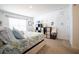 Well-lit bedroom featuring a queen bed, decorative wall art, and cozy furnishings at 3017 Country Club Cir, Winter Haven, FL 33881