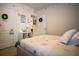 Cozy bedroom featuring a queen bed, closet, guest door, and decorative wall art at 3017 Country Club Cir, Winter Haven, FL 33881