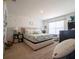Bright bedroom with decorative wall art, a comfy king bed, and neutral decor at 3017 Country Club Cir, Winter Haven, FL 33881
