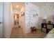 Hallway with decorative wall accents leading to a bathroom and additional rooms at 3017 Country Club Cir, Winter Haven, FL 33881