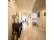 Spacious hallway features neutral walls, tiled flooring, and decorative accents throughout at 3017 Country Club Cir, Winter Haven, FL 33881