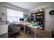 Bright home office space featuring a white desk, comfortable chair, and built-in shelving for storage at 3017 Country Club Cir, Winter Haven, FL 33881
