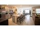 Open kitchen boasts stainless steel appliances, granite counters, and a breakfast bar with seating at 3017 Country Club Cir, Winter Haven, FL 33881
